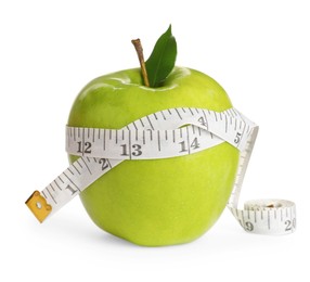 Fresh green apple with measuring tape on white background