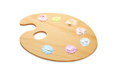 Wooden artist's palette with samples of pastel paints isolated on white