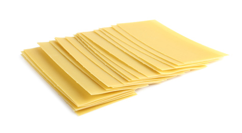 Photo of Uncooked lasagna sheets on white background. Italian cuisine