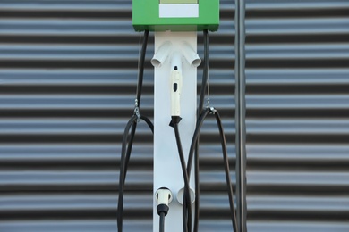 Electric vehicle charging station outdoors. Modern technology