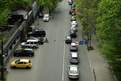 Cars in traffic jam on city street, aerial view