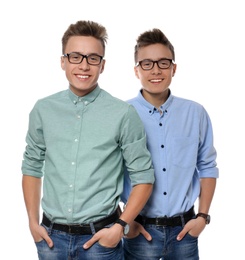 Teenage twin brothers with glasses on white background