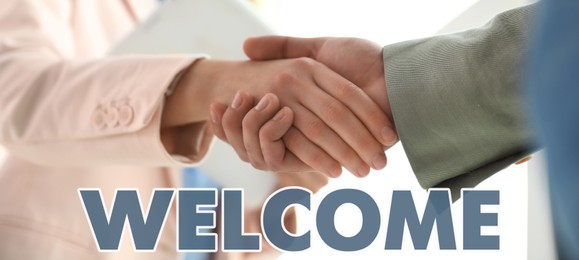 Welcome to team. Employee shaking hands with intern in office, closeup