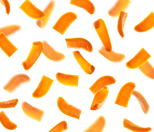 Image of Falling cut orange bell peppers on white background