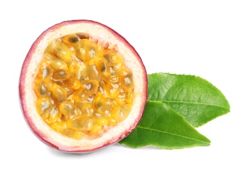 Half of fresh ripe passion fruit (maracuya) with green leaves isolated on white