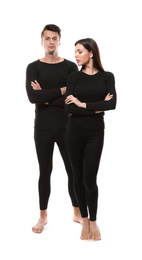 Couple wearing thermal underwear isolated on white