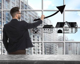 Real estate agent demonstrating prices at housing market. Man pointing on graph illustration