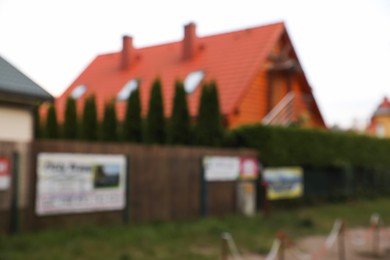Photo of Beautiful house outdoors, blurred view. Real estate for rent