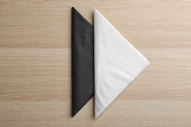 Clean paper tissues on wooden table, flat lay