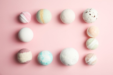 Photo of Flat lay composition with bath bombs and space for text on color background