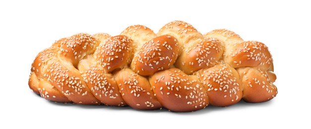 Homemade braided bread with sesame seeds isolated on white. Traditional Shabbat challah