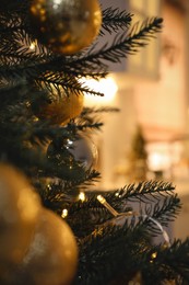 Closeup view of beautifully decorated Christmas tree indoors