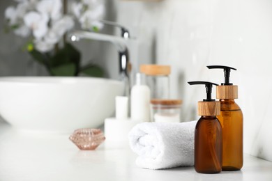 Different personal care products on countertop in bathroom. Space for text