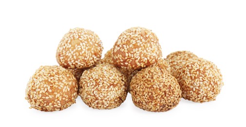 Photo of Many delicious sesame balls on white background