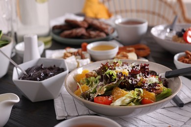 Delicious salad and many different dishes served on buffet table for brunch