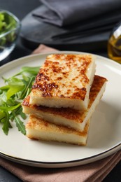 Delicious turnip cake with arugula served on table