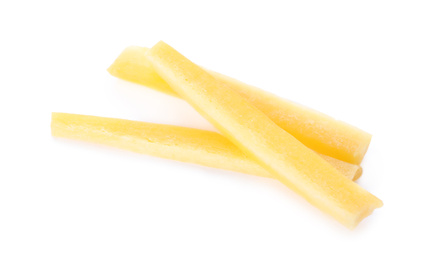 Raw yellow carrot sticks isolated on white