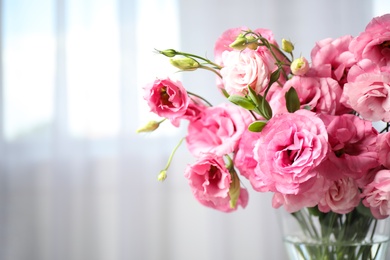 Beautiful pink Eustoma flowers on light background, closeup. Space for text