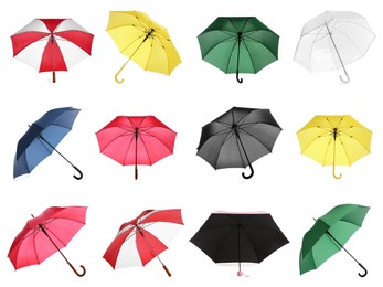 Set with different stylish umbrellas on white background 