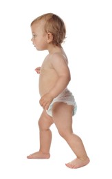 Cute baby in diaper learning to walk on white background