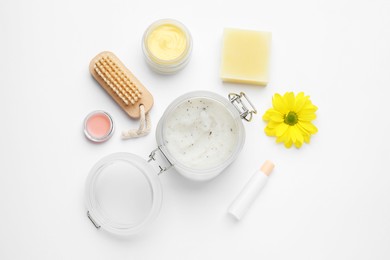 Flat lay composition with beeswax cosmetics on white background