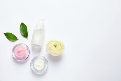 Cosmetic products on white background, flat lay