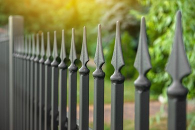 Railing of beautiful black iron fence outdoors, closeup