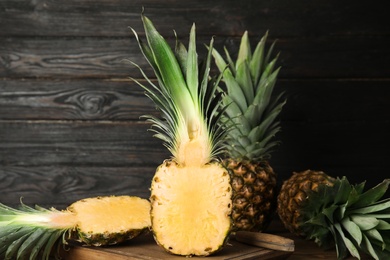 Cut fresh juicy pineapple on wooden board