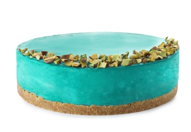Delicious spirulina cheesecake decorated with pistachios isolated on white