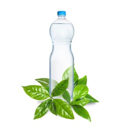 Bottle made of biodegradable plastic and green leaves on white background