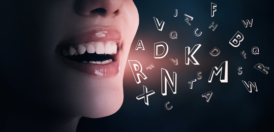 Smiling woman and letters on dark background, closeup. Banner design