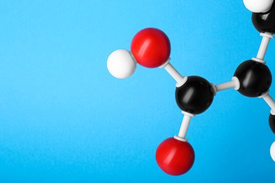 Photo of Closeup view of vitamin B3 molecule on light blue background, space for text. Chemical model