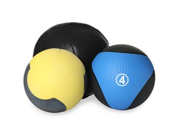 Different medicine balls on white background. Sport equipment