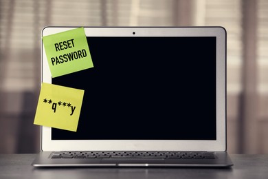 Sticky notes with passcode and phrase Reset Password on laptop. Space for text
