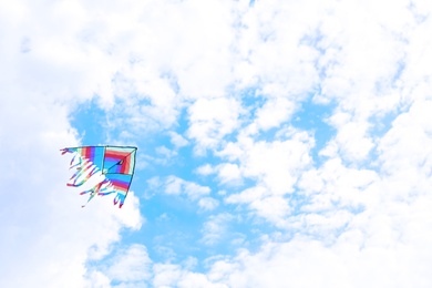 Beautiful kite drifting in blue sky