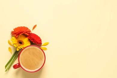 Photo of Beautiful colorful gerbera flowers, petals and cup of coffee on beige background, flat lay. Space for text
