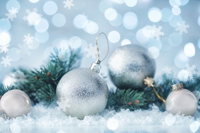 Greeting card design with beautiful Christmas balls and snowflakes, bokeh effect