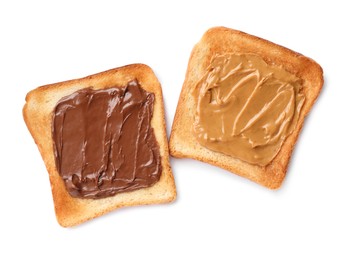 Photo of Tasty toasts with nut butter and chocolate paste on white background, top view