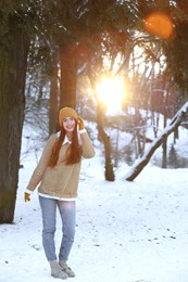 Photo of Beautiful young woman enjoying winter day outdoors