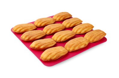 Photo of Many tasty madeleine cookies in baking mold isolated on white