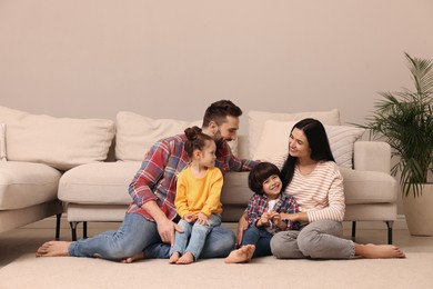 Happy family spending time together in living room