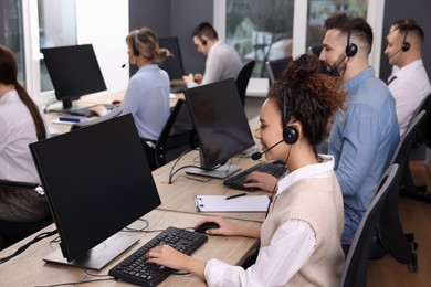 Call center operators working in modern office