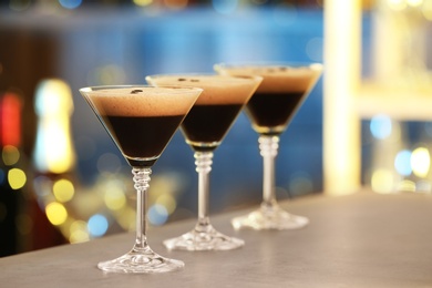 Glasses of delicious Espresso Martini on bar counter. Alcohol cocktail