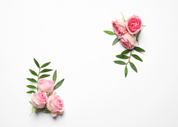 Composition of beautiful flowers and space for text on white background, top view. Floral card design