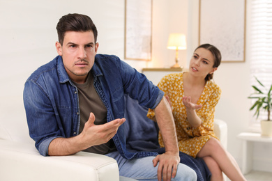 Couple quarreling due to jealousy in relationship at home