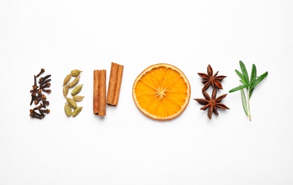 Different mulled wine ingredients on white background, flat lay