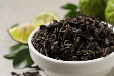 Dry bergamot tea leaves in bowl, closeup