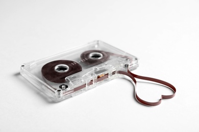 Music cassette and heart made with tape on white background. Listening love song