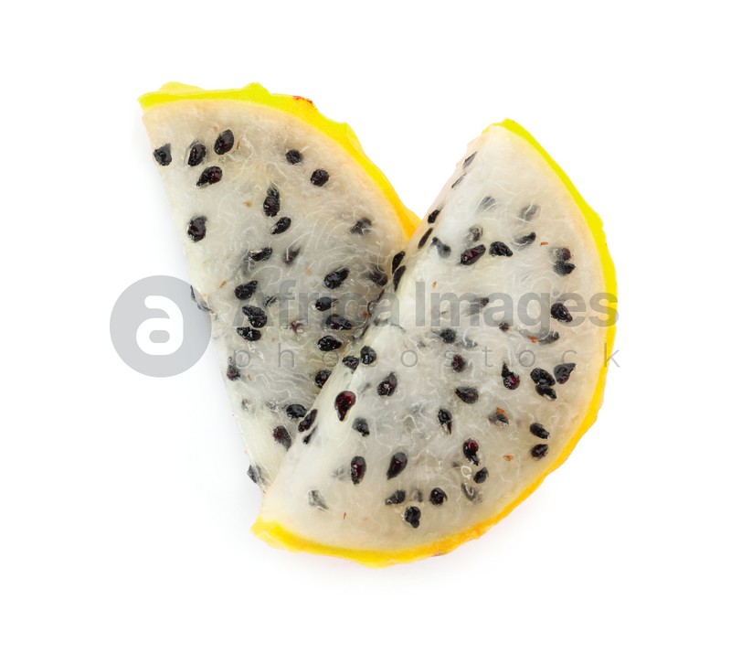 Slices of delicious yellow pitahaya fruit on white background, top view