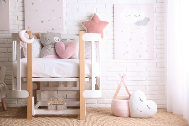 Baby room interior with toys and stylish furniture